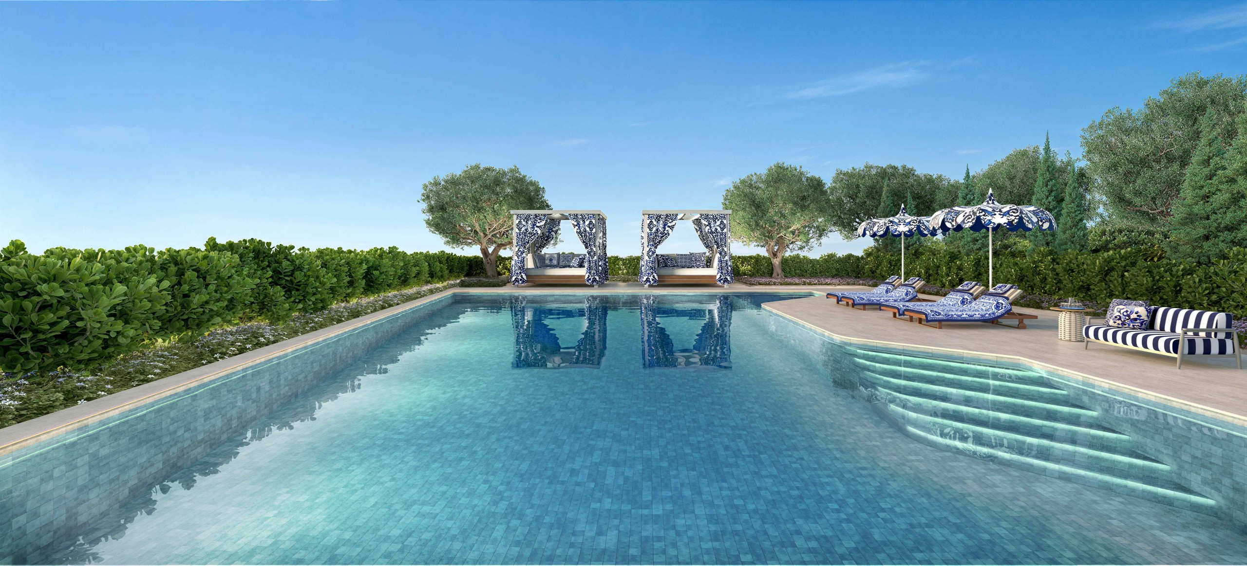 Piscina descoberta do Capri com cabanas e espreguiçadeiras listradas da Dolce&Gabbana Casa