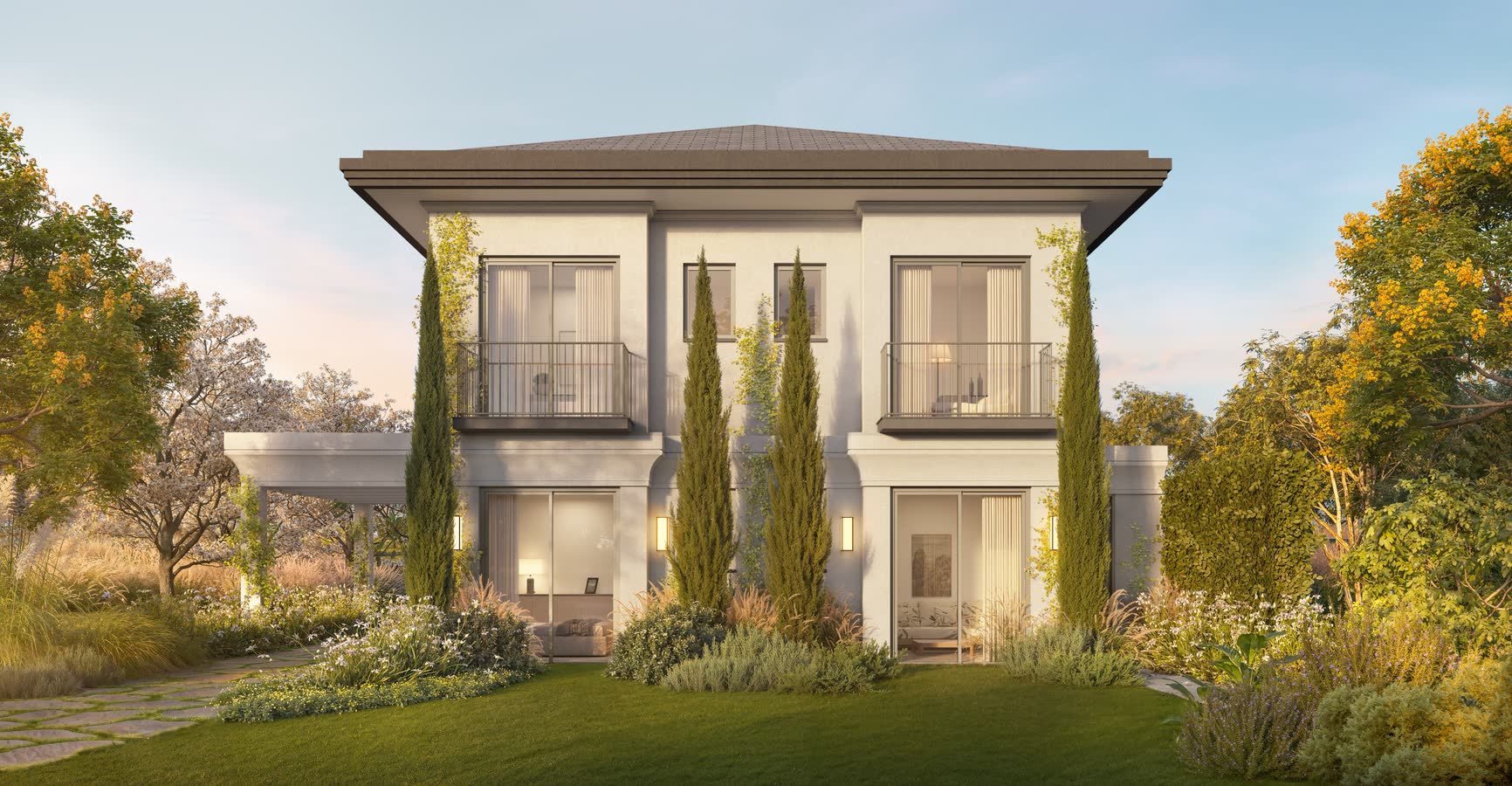 Fachada de casa Villa Riviera entre ciprestes